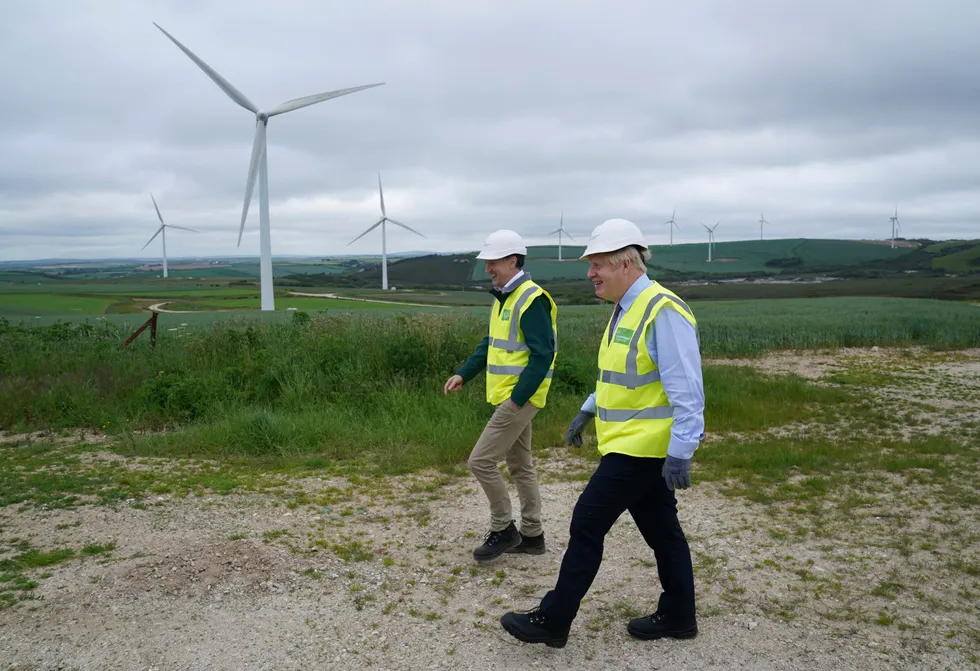 Greening the UK: UK Prime Minister Boris Johnson (right) visits the Scottish Power Carland Cross Windfarm in Newquay, England.