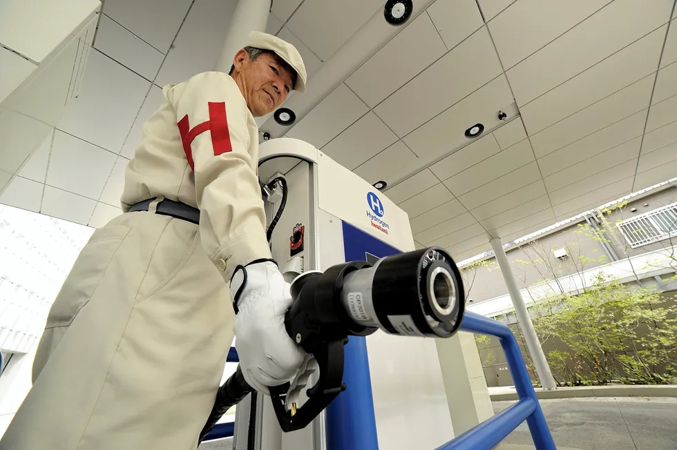 A worker at a hydrogen filling station in Japan shows off the unique dispensing nozzle. There are now 161 hydrogen refuelling stations in the country — about one for every 32 fuel-cell vehicles — all of which are heavily subsidised by the government.