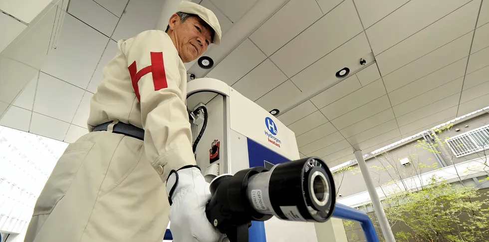 A worker at a hydrogen filling station in Japan shows off the unique dispensing nozzle. There are now 161 hydrogen refuelling stations in the country — about one for every 32 fuel-cell vehicles — all of which are heavily subsidised by the government.