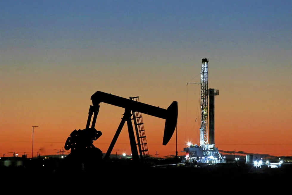 Lighting up: a pump jack in the shale stronghold of Midland, Texas