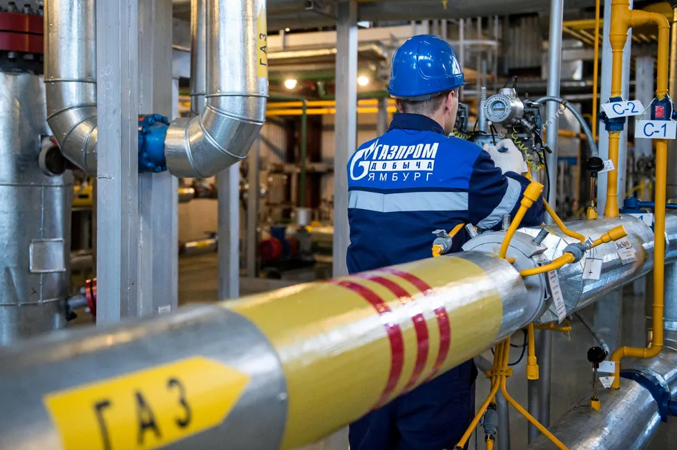 Taps open: a worker at a gas processing installation of Gazprom Dobycha Nadym in the Yamal-Nenets region in Russia