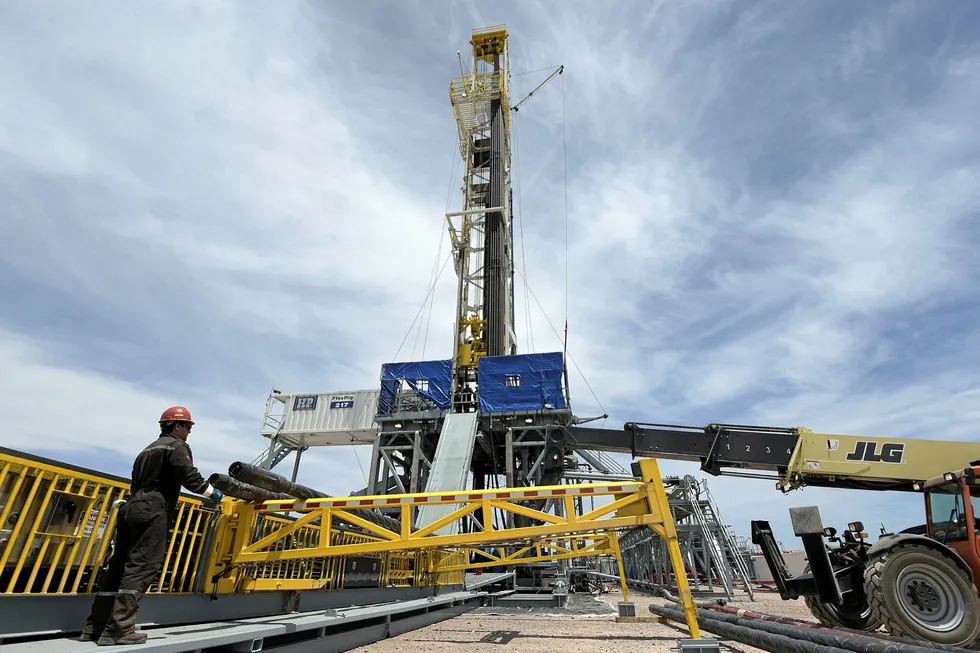 In play: a worker prepares a rig in the Vaca Muerta shale