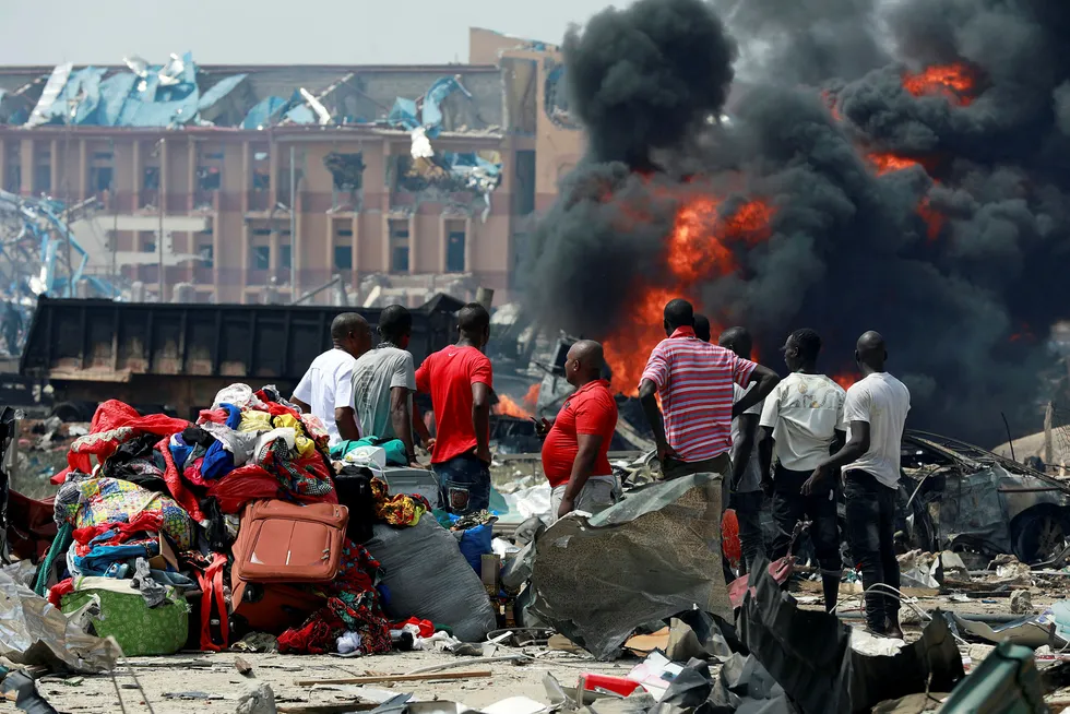 Huge blast: people gather with their belongings at the scene of the fire outbreak at Abule-Ado in Lagos, Nigeria March 15, 2020