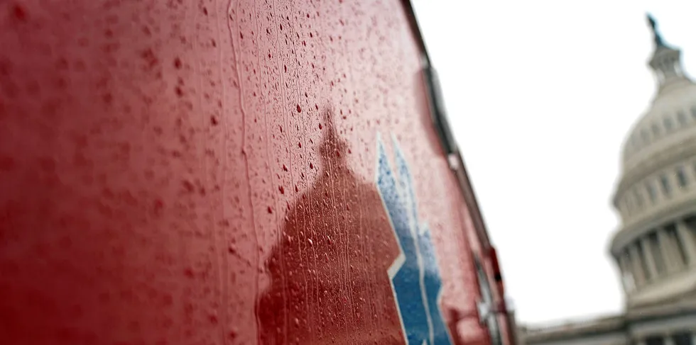 US Capitol Building reflected in on the side of an ambulance in Washington, DC, where the Senate passes a massive relief package for Americans and businesses ravaged by the coronavirus pandemic