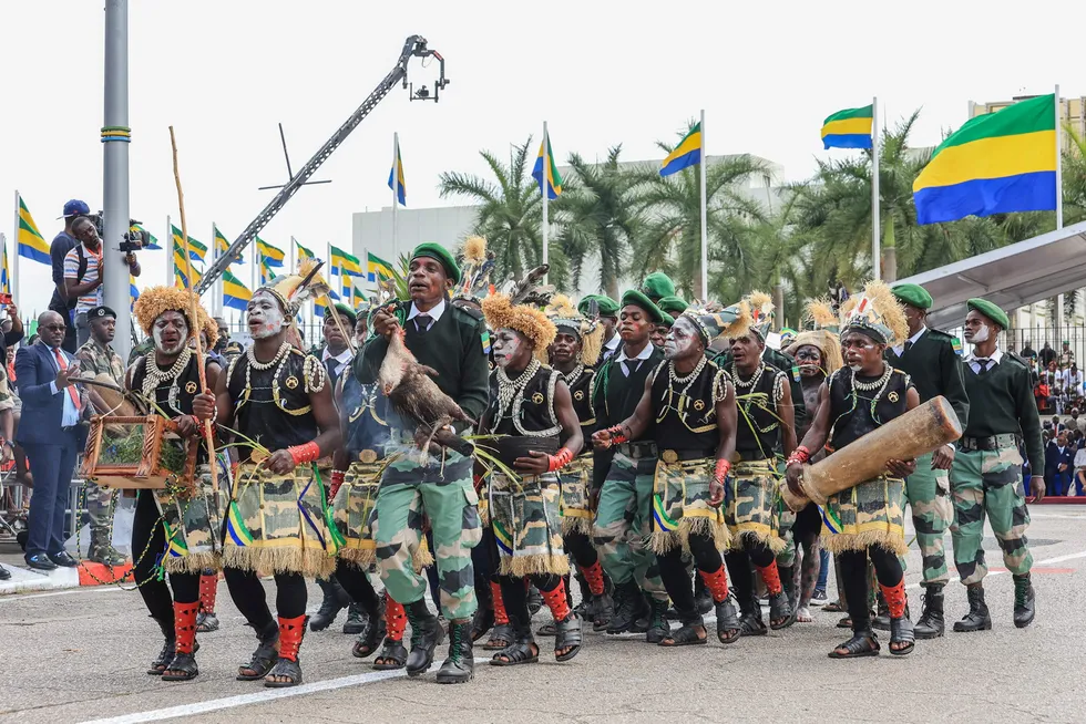 Libreville, Gabon: representatives of the Pygmy people walk ahead of the military parade held in honour of General Brice Oligui Nguema being inaugurated as Gabon's interim president on 4 September 2023.
