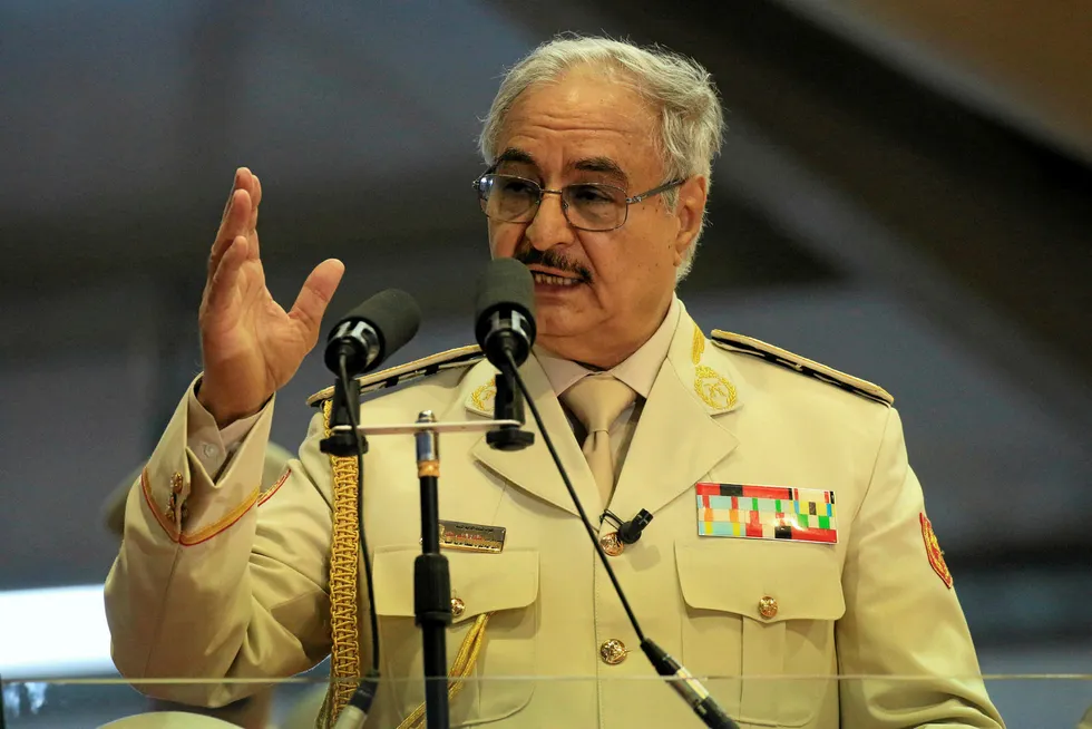 (FILES) In this file photo taken on May 7, 2018 Libyan Strongman Khalifa Haftar attends a military parade in the eastern city of Benghazi. A force led by Haftar said on June 21, 2018 it had recaptured two key oil ports, a week after they were seized by a rival militia in a blow to crucial exports. / AFP PHOTO / Abdullah DOMA