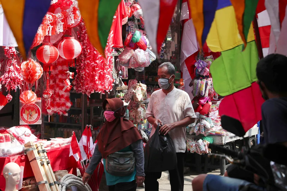 Preparing to celebrate: a national flag vendor at a market in Indonesia's capital Jakarta