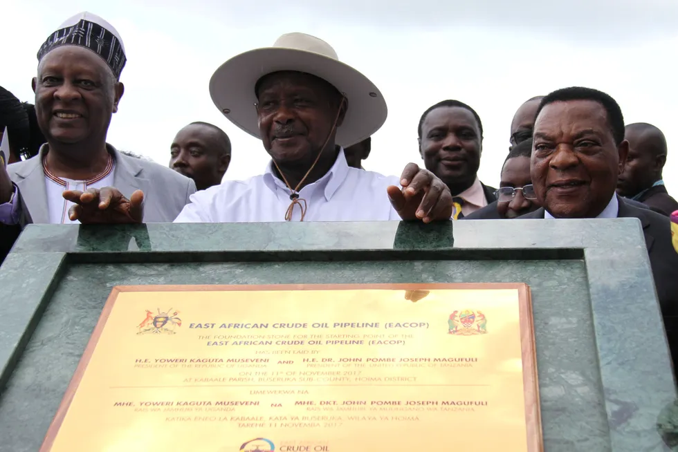 Vital awards: Uganda’s President Yoweri Museveni (centre) poses with King of Bunyoro (left) and Tanzania’s former foreign minister Augustine Mahiga during a ceremony marking the laying of the foundation stone for the starting point of the East Africa Crude Oil Pipeline (EACOP) in Kabaale, Uganda in 2017