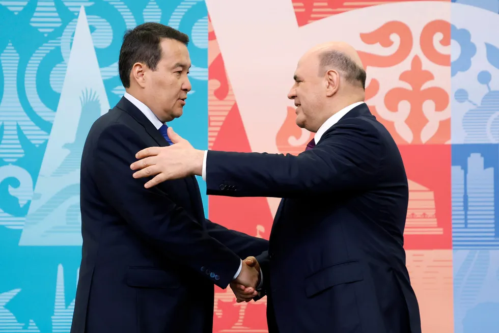 Liaisons: Kazakh Prime Minister Alikhan Smailov (left) greets Russian Prime Minister Mikhail Mishustin (right).