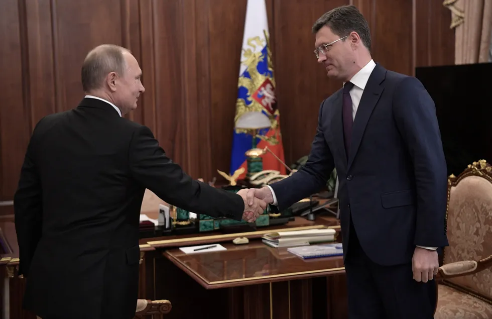 Promises: Russian President Vladimir Putin (left) shakes hands with Deputy Prime Minister Alexander Novak.