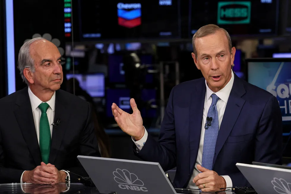 C-suite discussions: Hess chief executive John Hess (left), with Chevron chief executive Mike Wirth on the floor of the New York Stock Exchange on Monday.