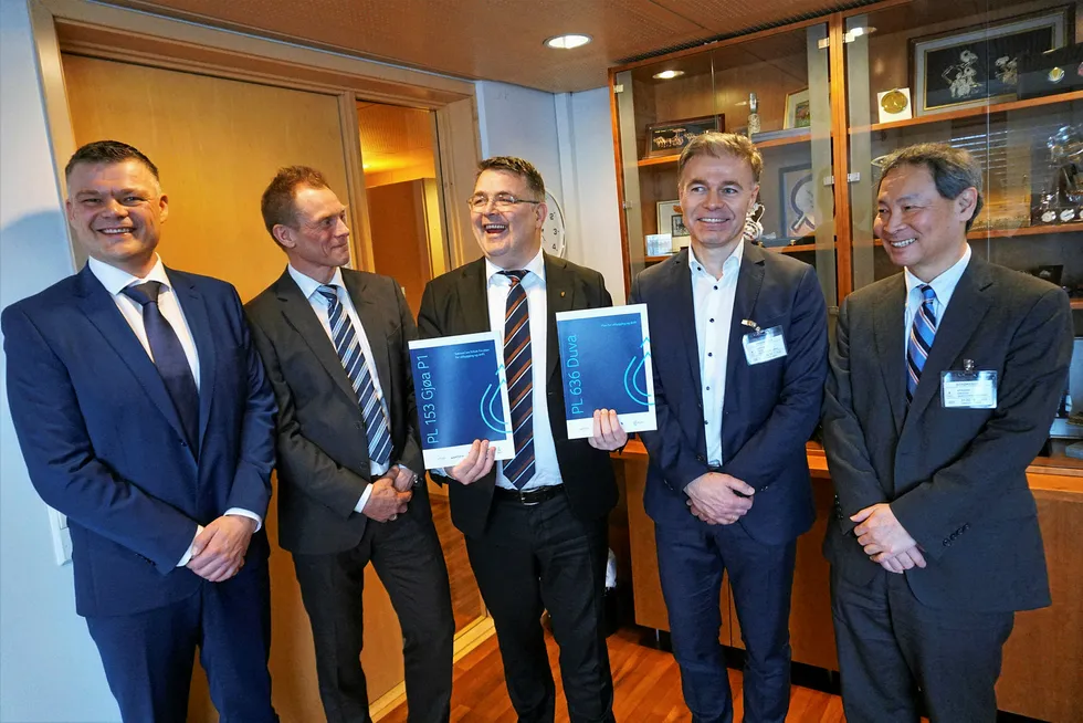 Plans afoot: Norway's Petroleum & Energy Minister Kjell-Borge Freiberg takes delivery of Duva and P1 PDOs with representatives from operator Neptune Energy and its partners