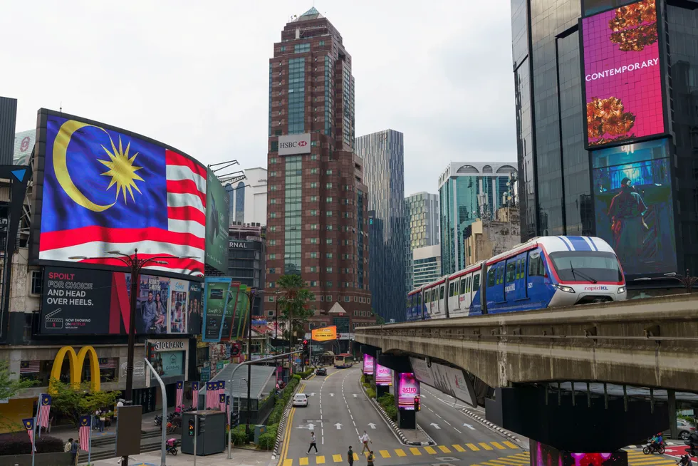 Hot spot: the Malaysian flag on a signboard in downtown Kuala Lumpur, Malaysia