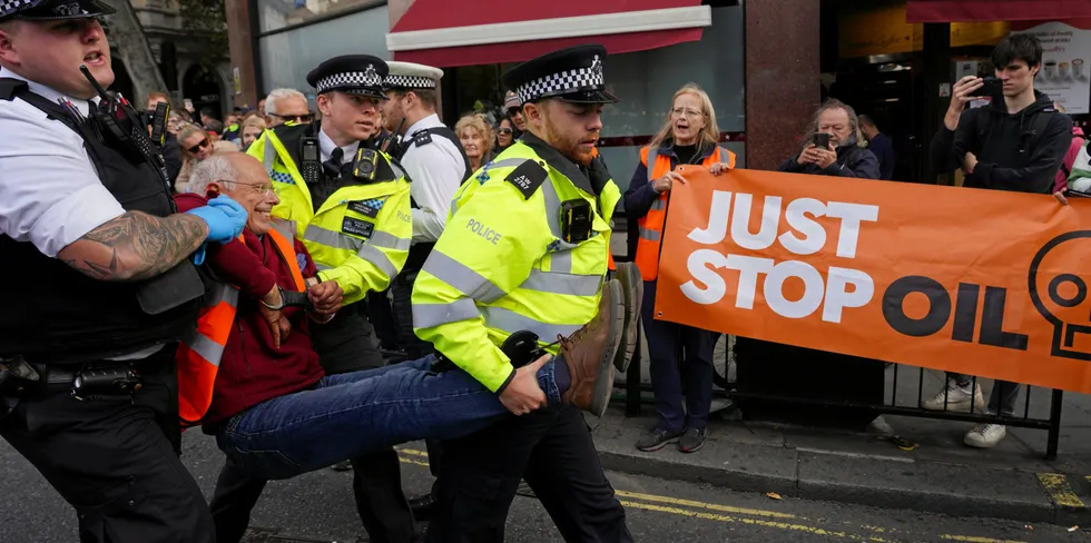 Just Stop Oil climate activists block traffic in Trafalgar Square, London.