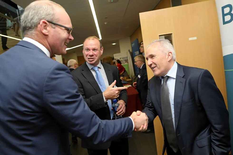 Richard Donnelly of BIM (center) with Irish Minister for Foreign Affairs and Minister for Defence Simon Coveney (left) and Andy Mulloy of Connemara Seafoods (right).
