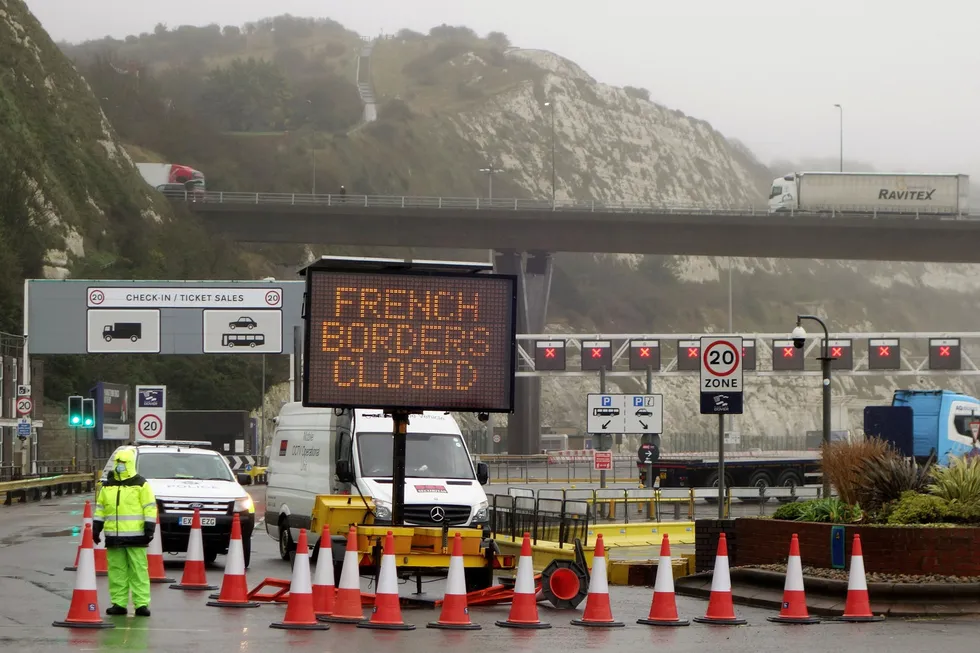 Borders closed: Oil prices fell Monday after a string of countries banned travellers from the UK, due to the rapid spread of a more infectious new coronavirus strain. Here, a sign alerts customers, "French Borders Closed", at the Port of Dover entrance in south east England.