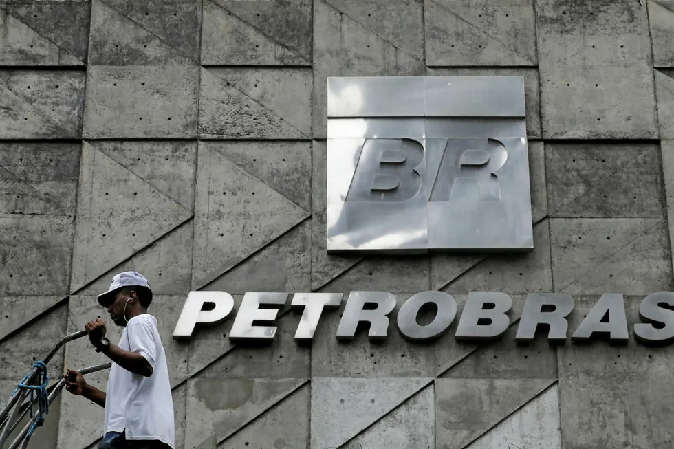 Negotiations: a man walks past the headquarters of state-run Brazilian oil giant Petrobras in Rio de Janeiro