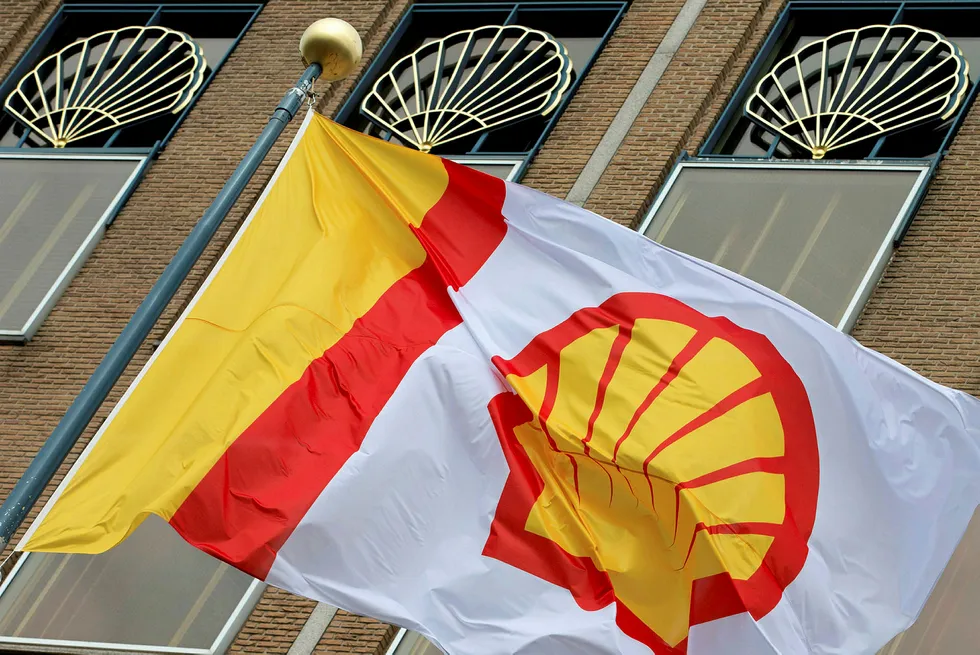 FILE - In this Monday, April 7, 2014 file photo, a flag bearing the company logo of Royal Dutch Shell, an Anglo-Dutch oil and gas company, flies outside the head office in The Hague, Netherlands. (AP Photo/Peter Dejong, File) . .
