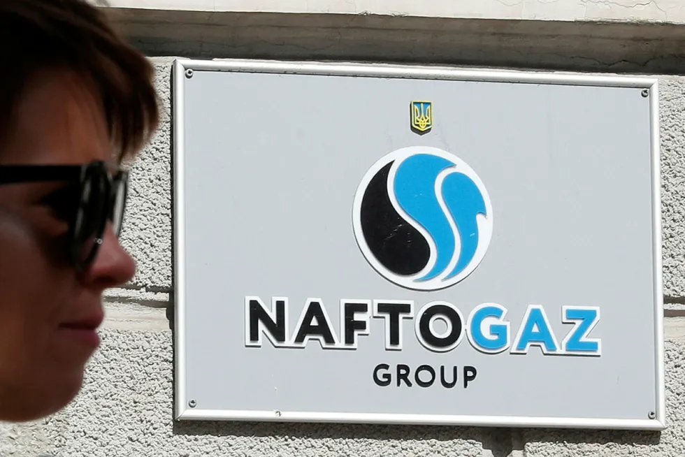 A woman walks past the headquarters of the Ukrainian state energy company Naftogaz in central Kiev, Ukraine September 13, 2019. REUTERS/Valentyn Ogirenko