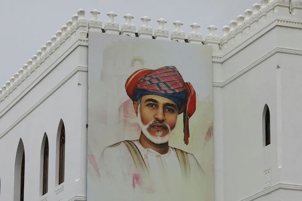 Leadership change: a painting of Oman's Sultan Qaboos bin Said is seen on a building in Muscat, Oman