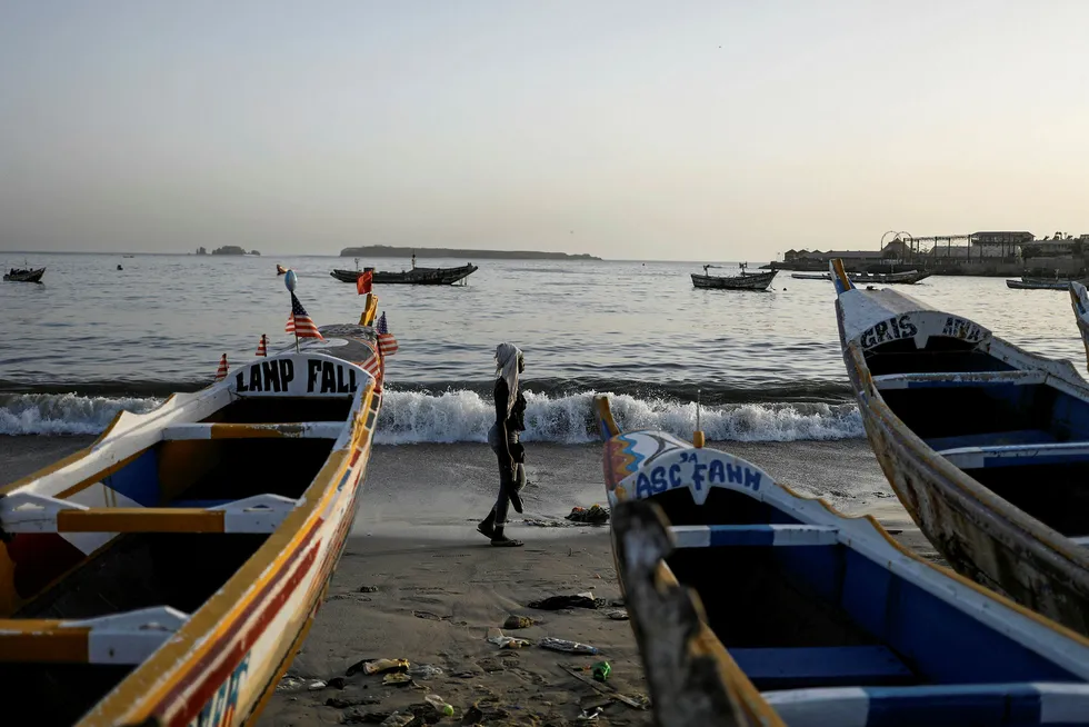 Round under way: fishing boats on the shore in Senegal's capital Dakar