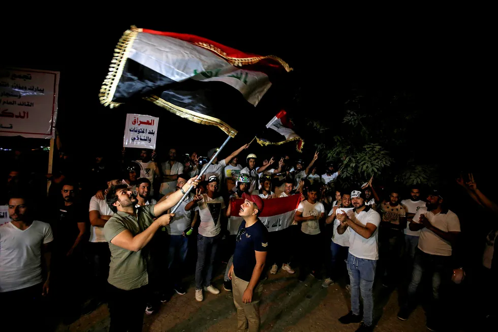 Flag day: Iraqis celebrate in Baghdad after Kirkuk was seized by the nation's forces