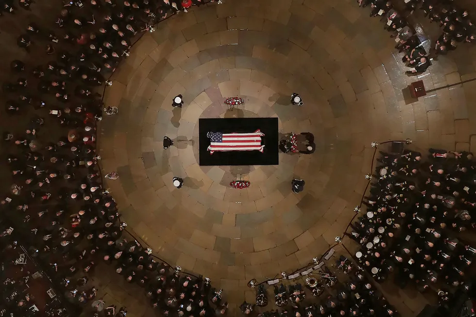 TOPSHOT - Vice President Mike Pence and wife Karen help lay a wreath as former President George H. W. Bush lies in state in the US Capitol Rotunda Monday, December 3, 2018, in Washington, DC. (Photo by Morry Gash / POOL / AFP) / POOL PHOTO ---