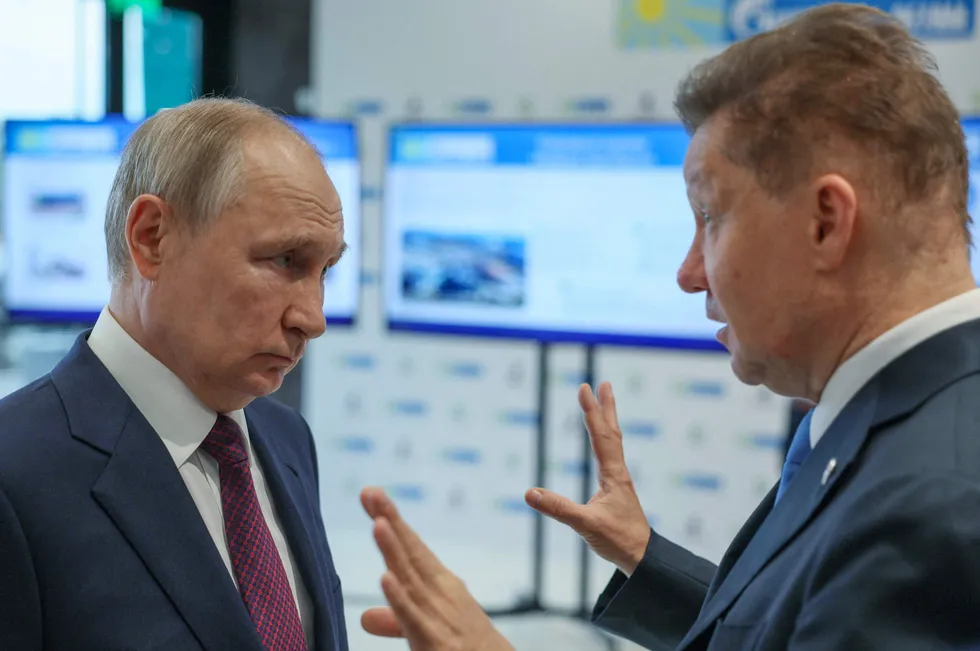 Cutting exposure: Russian President Vladimir Putin (left) talks to Gazprom executive chairman Alexei Miller.