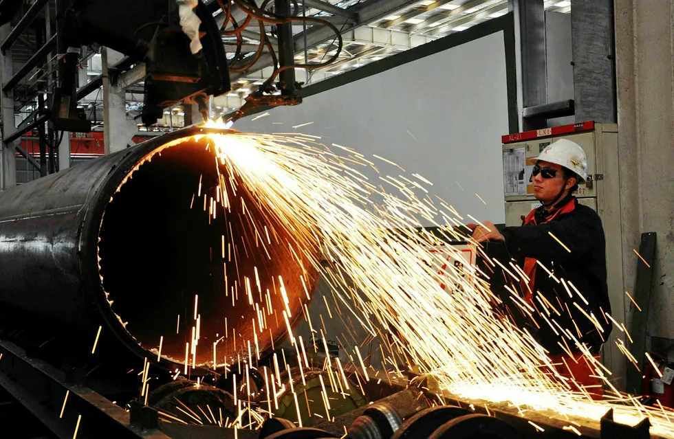 Reforms: pipeline being cut at a factory in Qingdao, Shandong province, China