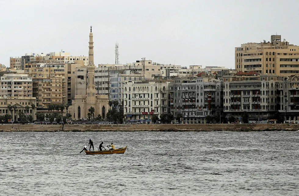 Casting off: men fish during off the Mediterranean city of Alexandria, Egypt