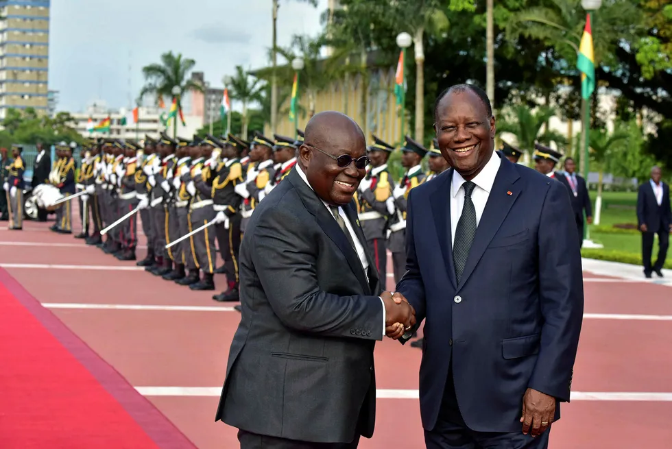 No hard feelings: Ghana's President Nana Akufo-Addo (left) is welcomed earlier this year by Ivory Coast's President Alassane Ouattara in Abidjan, Ivory Coast