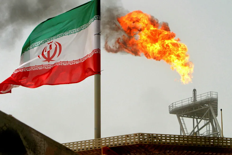 Iran blast: a gas flare on an oil production platform in the Soroush oilfields is seen alongside an Iranian flag