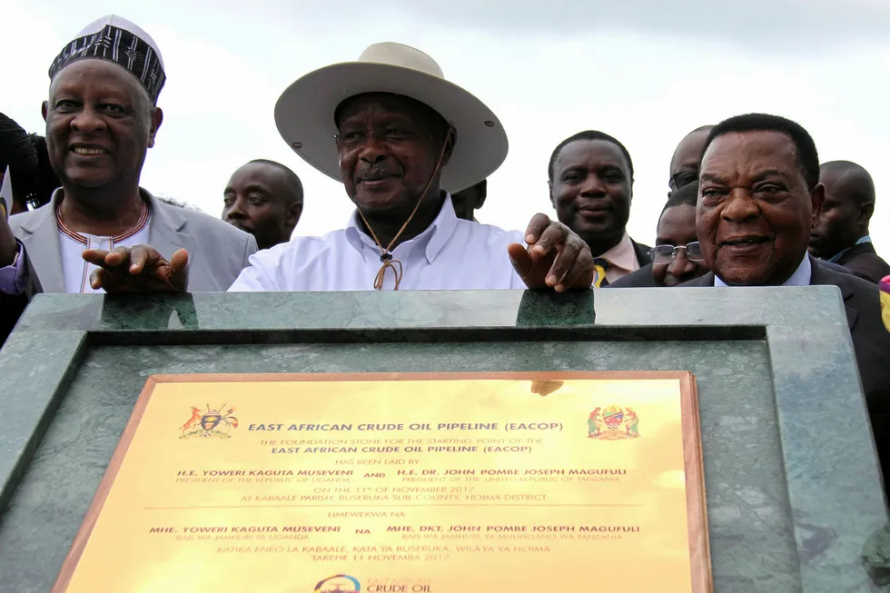 Milestone: Uganda's President Yoweri Museveni (centre) with Tanzania's Minister of Foreign Affairs Augustine Mahiga (right) during a ceremony marking the laying of the foundation stone for the starting point of the East Africa Crude Oil Pipeline