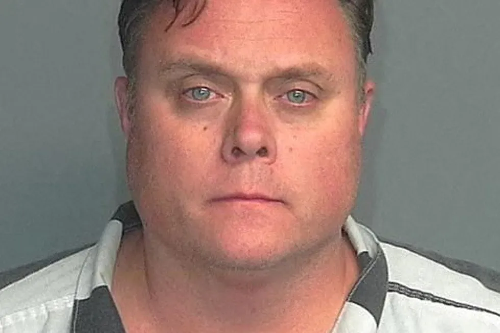 David Scott, head of ExxonMobil‘s shale oil and gas business, is seen in a police mug shot obtained by Reuters.