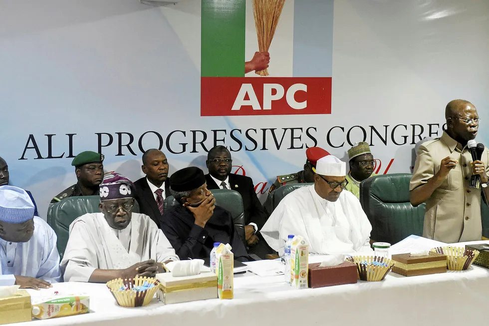 Election hiatus: incumbent President Muhammadu Buhari (in white) sits next to party chairman Adams Oshiomhole (far right)