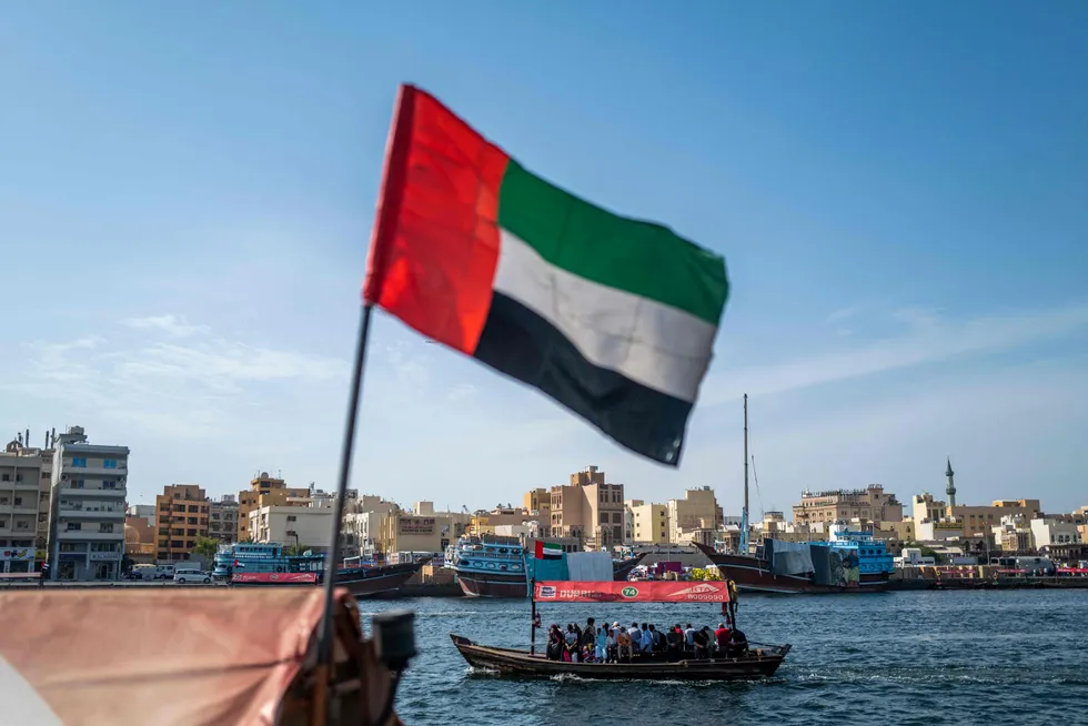 Carbon capture: A UAE flag flies along Dubai Creek.