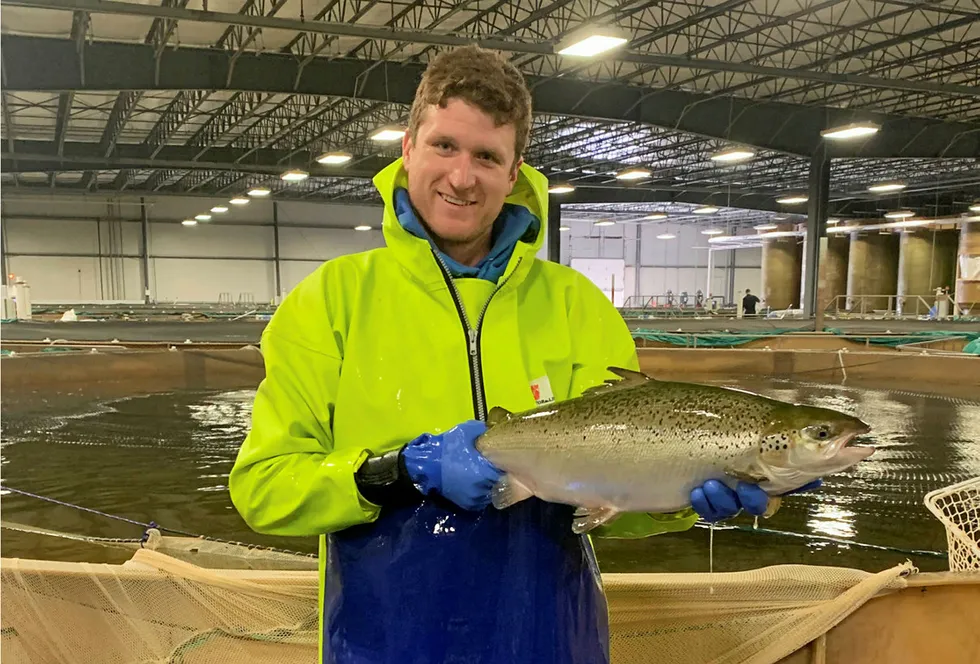 Peter Bowyer, a facility manager at AquaBounty, with its first commercial land-based salmon to be sold to US consumers.