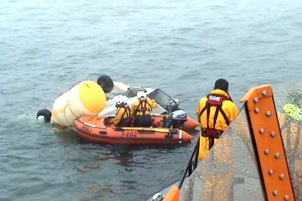Tragedy: a video still image taken from footage shot on 25 August 2013 and released by the Royal National Lifeboat Institution and coastguard of work to collect debris from the crashed helicopter