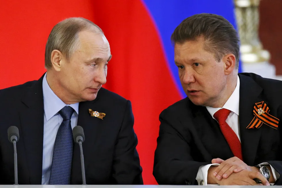 Head to head: Russian President Vladimir Putin (left) in conversation with Gazprom executive chairman Alexei Miller