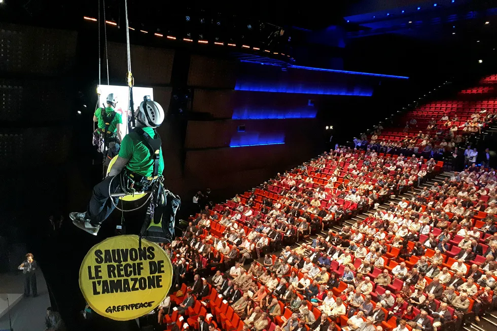 Knowing the ropes: Greenpeace protest at the Total annual shareholders meeting