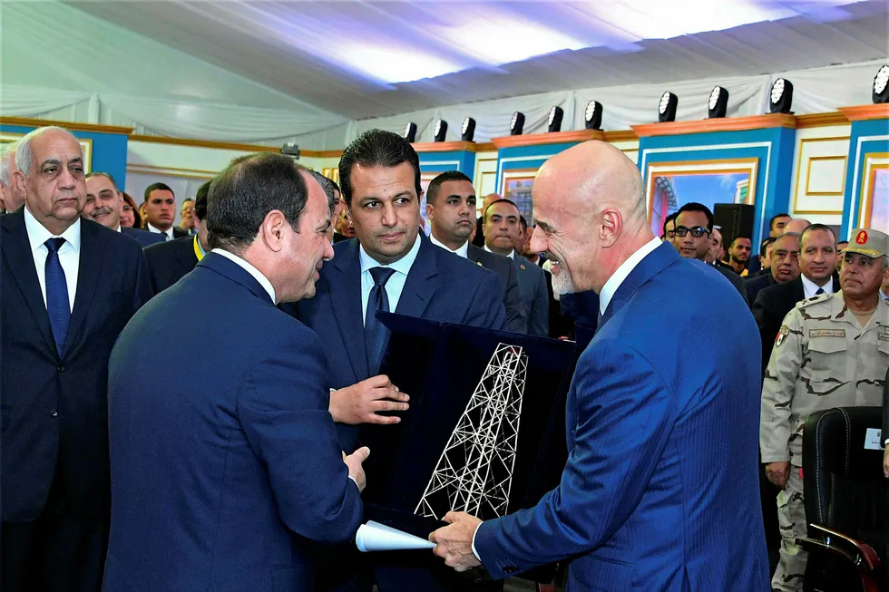 Meeting: Eni chief executive Claudio Descalzi (centre right) presents Egyptian President Abdel-Fattah el-Sissi with a gift during a ceremony marking the start of the massive Zohr gas project