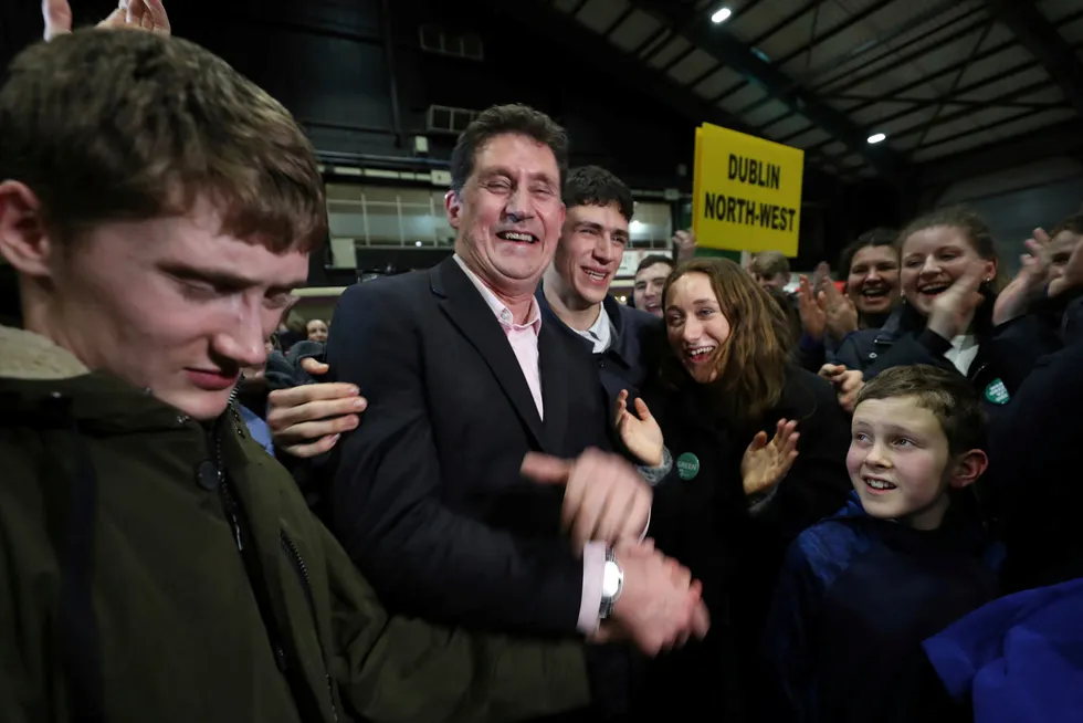 Ban: Green Party leader Eamon Ryan surrounded by his family during the Irish General Election count in Dublin in February last year