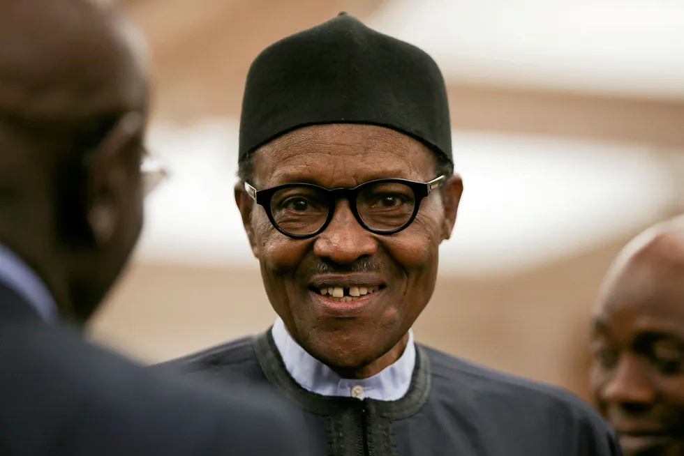 Keep smiling through: Nigerian President Muhammadu Buhari hopes to break a 20-year jinx on oil sector law reform