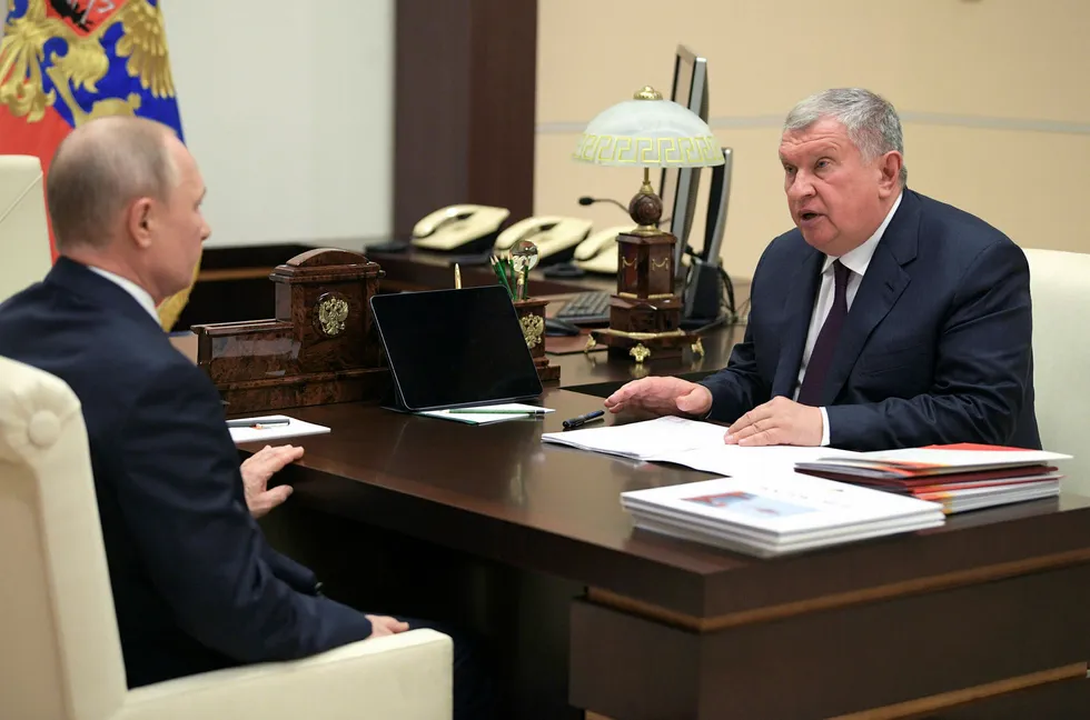 Distress call: Russian President Vladimir Putin (left) meets Rosneft chairman Igor Sechin at the Novo-Ogaryovo state residence outside Moscow