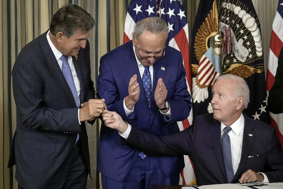 Signing up: US President Joe Biden (right), with Senator Joe Manchin (left) and Senate Majority Leader Charles Schumer (centre) at the signing of The Inflation Reduction Act.