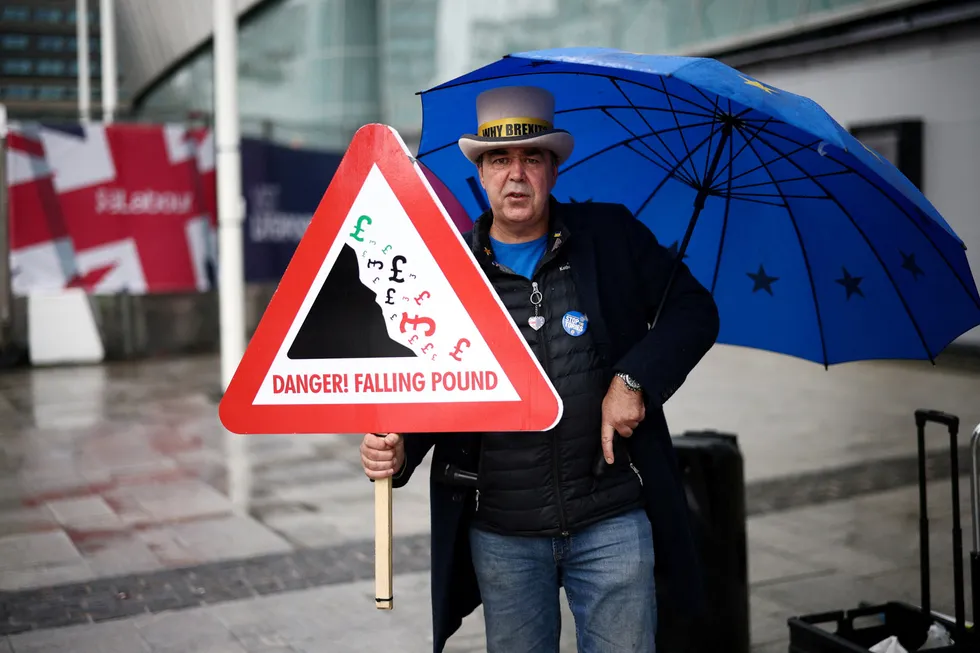 Anti-Brexit protester Steve Bray holds a placard outside the entrance to the Labour Party Conference in Liverpool, Britain, September 27, 2022. REUTERS/Henry Nicholls