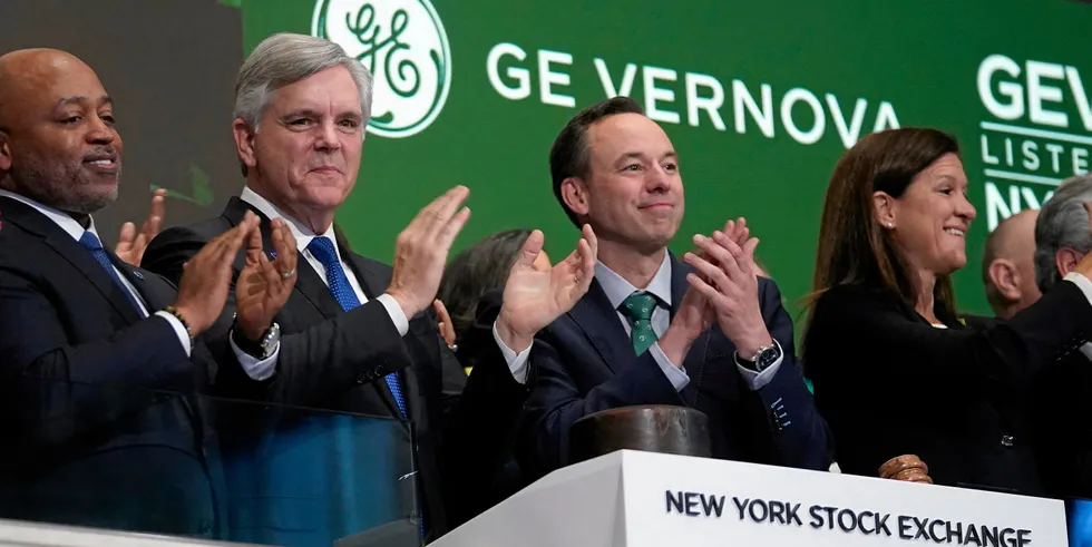 GE Vernova CEO Scott Strazik (2nd right) rings the opening bell at the New York Stock Exchange.