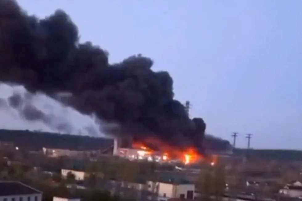Aftermath: Smoke and fire rise from the site of a missile strike at the Trypilska power station following Russia's 11 April overnight attack.