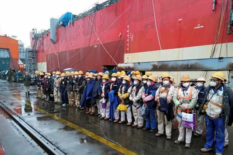 Precaution: workers take health tips before starting work on the Karish FPSO at Cosco Shipping Heavy Industry’s yard in Zhoushan