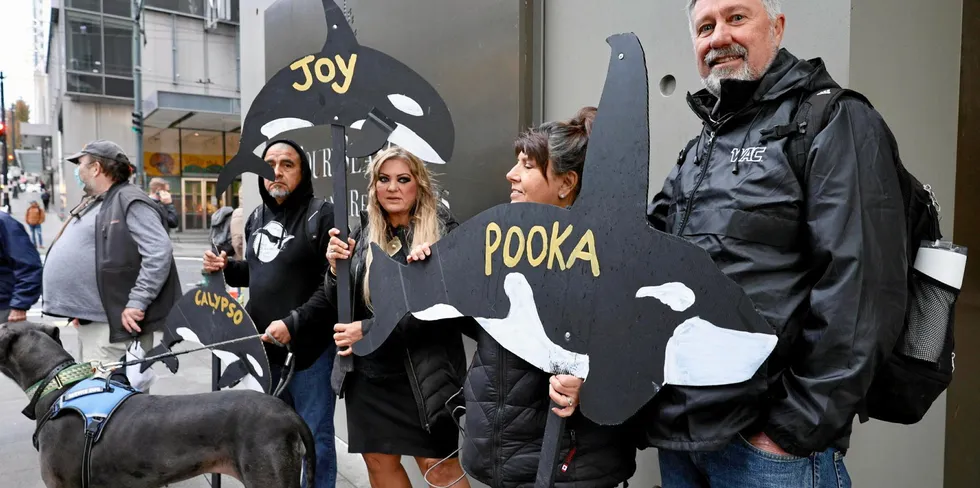 Protestors stand outside GAPP's 2023 conference held at the Four Seasons in Seattle on Sept. 28.